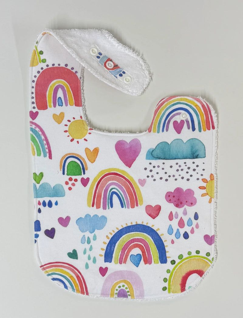 LITTLE WARRIOR & CO ORGANIC COTTON FEEDING BIB- RAINBOWS OF HOPE