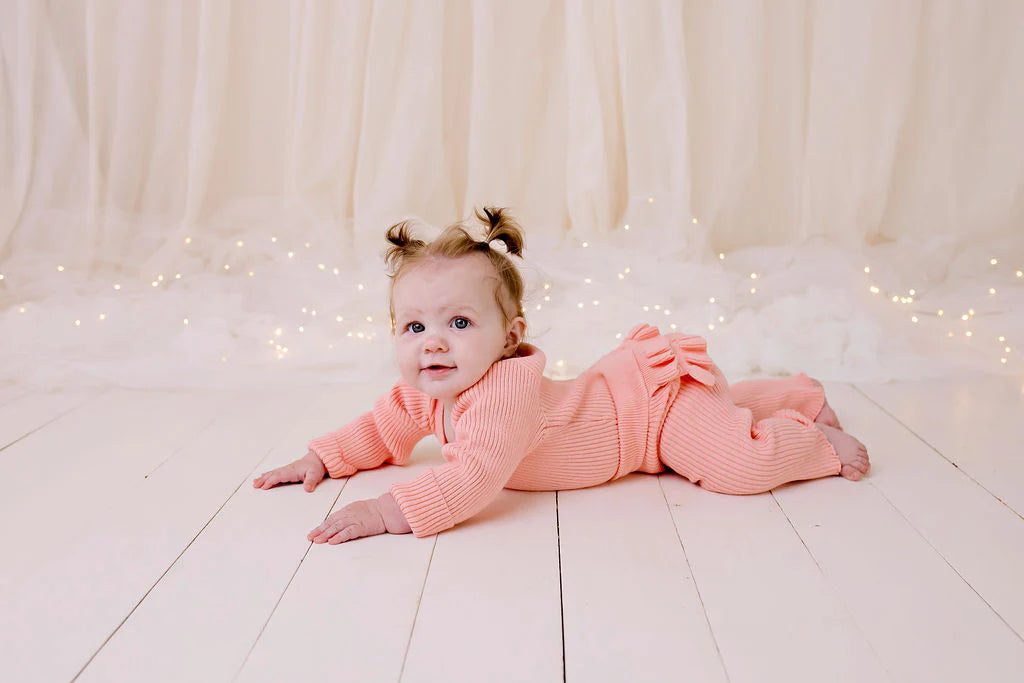 CONFETTI KIDZ FRILLY RIBBED KNIT BODYSUIT - PEACH