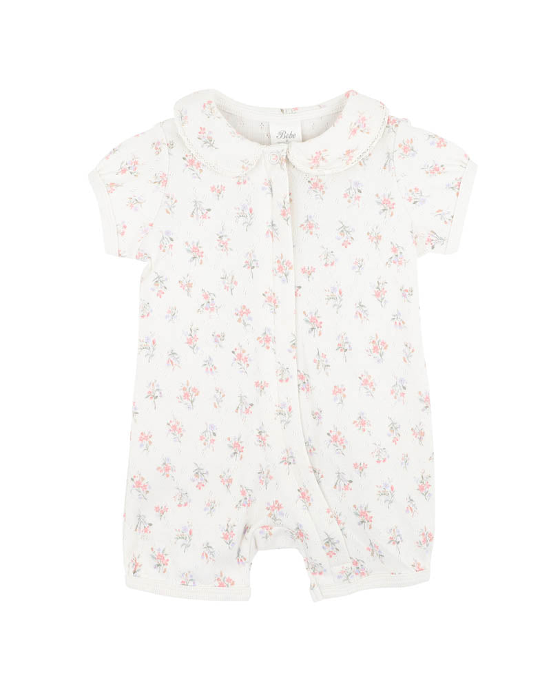 BEBE ORGANIC ANYA DISTY PRINT SHORT SLEEVE ROMPER